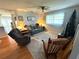 Inviting living room with a comfortable seating area and natural light from the window at 11737 Spring Tree Ln, Port Richey, FL 34668