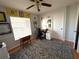 Home office features natural light, desk, chair and decorations at 11737 Spring Tree Ln, Port Richey, FL 34668