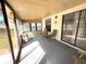 Enclosed patio with two chairs and a table at 11737 Spring Tree Ln, Port Richey, FL 34668