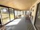 Enclosed patio with two chairs and a table at 11737 Spring Tree Ln, Port Richey, FL 34668