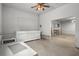 Unfinished basement featuring concrete floors, a peg board, cabinetry, and access to another room at 13289 Joy Path, Brooksville, FL 34601