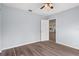 Bedroom features updated flooring, base molding, fan and view to the rest of the home at 13289 Joy Path, Brooksville, FL 34601