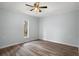 Updated bedroom featuring wood-look floors and a window at 13289 Joy Path, Brooksville, FL 34601