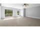 Bright bonus room with tile flooring, ceiling fan and exterior sliding glass door at 13289 Joy Path, Brooksville, FL 34601