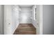Walk-in closet featuring laminate flooring, multiple shelves, and a window, providing plenty of storage at 13289 Joy Path, Brooksville, FL 34601