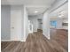 Spacious entryway featuring beautiful wood-look floors, a white door and neutral colored walls at 13289 Joy Path, Brooksville, FL 34601