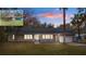 Charming single-story home featuring a welcoming front porch, attached garage and mature landscaping at 13289 Joy Path, Brooksville, FL 34601
