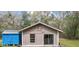 View of a one-car garage from the backyard at 13289 Joy Path, Brooksville, FL 34601