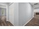 Hallway with a large closet featuring wood-look flooring at 13289 Joy Path, Brooksville, FL 34601