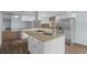 Gourmet kitchen with granite island, stainless appliances, and ample storage at 13289 Joy Path, Brooksville, FL 34601