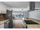 The bright kitchen features an island with a cooktop and an adjacent eating area at 13289 Joy Path, Brooksville, FL 34601