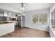 Bright kitchen featuring stainless appliances, white cabinetry and an island with cooktop at 13289 Joy Path, Brooksville, FL 34601