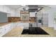 Updated kitchen featuring stainless steel appliances, granite countertops, and a modern range hood at 13289 Joy Path, Brooksville, FL 34601