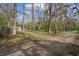 Beautiful wooded land with mature trees offers privacy and potential for building your dream home at 13289 Joy Path, Brooksville, FL 34601