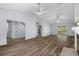 Spacious living room with vaulted ceilings, ceiling fans, modern flooring and fireplace at 13289 Joy Path, Brooksville, FL 34601
