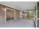 Spacious screened porch with sliding glass door entry to the home at 13289 Joy Path, Brooksville, FL 34601