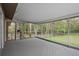 Large screened porch with wooded view is perfect for entertaining at 13289 Joy Path, Brooksville, FL 34601