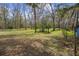 A large lot with mature trees and a partially fenced yard at 13289 Joy Path, Brooksville, FL 34601