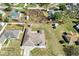 Aerial view of the property showcasing its expansive yard, outbuildings, and neighborhood at 13419 Banner Rd, Spring Hill, FL 34609