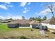 View of backyard with a patio, fire pit, and green space perfect for outdoor gatherings and relaxation at 13419 Banner Rd, Spring Hill, FL 34609