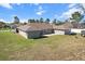 Wide open backyard with ample green space and views of neighboring houses at 13419 Banner Rd, Spring Hill, FL 34609