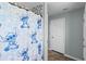 Bathroom featuring a shower with a fun character-themed curtain and tile accents at 13419 Banner Rd, Spring Hill, FL 34609