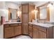 Bathroom featuring granite countertop, double sinks, and wood cabinets at 13419 Banner Rd, Spring Hill, FL 34609