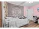 Bedroom featuring wood floors, a large tapestry, and access to other rooms at 13419 Banner Rd, Spring Hill, FL 34609