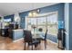 Dining area with a bay window and a view of the outdoors, featuring a chandelier at 13419 Banner Rd, Spring Hill, FL 34609