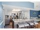 Kitchen with central island with seating, stainless steel appliances, and modern lighting at 13419 Banner Rd, Spring Hill, FL 34609