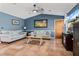 Comfortable living room with tile floors, vaulted ceiling, and natural light at 13419 Banner Rd, Spring Hill, FL 34609