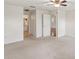 Bedroom featuring neutral walls, carpet, and access to an ensuite bathroom at 18325 Whitacre Cir, Hudson, FL 34667