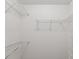 Spacious walk-in closet with white walls and wire shelving for organized storage at 18325 Whitacre Cir, Hudson, FL 34667