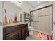 Modern bathroom with a glass-enclosed shower, dark wood vanity, and stylish fixtures at 19770 Tattnall Way, Brooksville, FL 34601