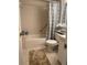 Full bathroom with tub and shower combination, white vanity and tile flooring at 2642 Pine Ridge S Way # B2, Palm Harbor, FL 34684