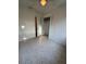 Bedroom with ceiling fan, closet, and terrazzo flooring at 301 Longwood Dr, Brooksville, FL 34601