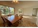 Dining area flows into the living space, featuring neutral tones and natural light at 301 Longwood Dr, Brooksville, FL 34601