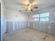 Bright bedroom featuring ceiling fan and natural light from a window at 330 83Rd Ave Ne, St Petersburg, FL 33702