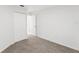 Well-lit bedroom with plush carpeting and closet provides a comfortable retreat at 3403 Holly Springs Dr, Hernando Beach, FL 34607