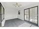 Bright bonus room with sliding glass doors and a ceiling fan at 3403 Holly Springs Dr, Hernando Beach, FL 34607