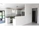 Open kitchen with white cabinetry, granite countertops, and stainless steel appliances at 3403 Holly Springs Dr, Hernando Beach, FL 34607