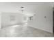 Bright, spacious living room with a ceiling fan and tile floors, offering an open and airy feel at 3403 Holly Springs Dr, Hernando Beach, FL 34607