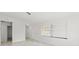 Living room with natural light highlighting the modern tile floors and freshly painted white walls at 3403 Holly Springs Dr, Hernando Beach, FL 34607