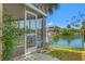 Outdoor screened patio offers picturesque waterfront views at 3403 Holly Springs Dr, Hernando Beach, FL 34607