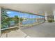 An alternate angle of the screened in porch with clear views of the canal and dock at 3403 Holly Springs Dr, Hernando Beach, FL 34607