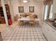 Dining Room Area featuring white checkered flooring and view to outdoor at 4295 Tahiti Dr, Hernando Beach, FL 34607