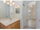 Well-lit bathroom with a single sink vanity and a mirrored medicine cabinet at 4412 Caliquen Dr, Brooksville, FL 34604