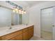 Bathroom with double vanity, lots of counter space, and closet at 4412 Caliquen Dr, Brooksville, FL 34604