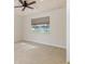 Bedroom featuring a large window and neutral carpet at 4412 Caliquen Dr, Brooksville, FL 34604