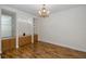 Elegant dining room featuring hardwood floors, built-in cabinets, and a decorative chandelier at 4412 Caliquen Dr, Brooksville, FL 34604